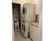 Efficient laundry area with stacked washer and dryer, plus extra storage space for supplies at 1001 Ray Costin Way # 1605, Murrells Inlet, SC 29576