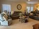 Inviting living room featuring a comfortable seating arrangement, and neutral decor that creates a relaxing atmosphere at 1001 Ray Costin Way # 1605, Murrells Inlet, SC 29576