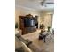 Comfortable living room featuring a large television, stylish furniture, and neutral decor at 1001 Ray Costin Way # 1605, Murrells Inlet, SC 29576