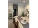 Comfortable main bedroom with bedside tables and lamps, tray ceilings, and carpeted floor at 1001 Ray Costin Way # 1605, Murrells Inlet, SC 29576