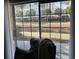 Serene view from the patio overlooking a canal with a swan, with patio furniture in the foreground at 1001 Ray Costin Way # 1605, Murrells Inlet, SC 29576