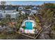 Aerial view highlighting property's fenced pool and landscaping within a beautiful marshside community at 1004 Marsh View Dr., North Myrtle Beach, SC 29582