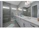 Elegant bathroom featuring double sinks, granite countertops, and a glass shower at 1004 Marsh View Dr., North Myrtle Beach, SC 29582