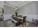 Elegant dining room featuring modern lighting, a wooden table with bench seating, and chic decorative accents at 1004 Marsh View Dr., North Myrtle Beach, SC 29582