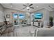 Relaxing living room featuring a sliding glass door to the porch, a mounted TV, and neutral decor at 1004 Marsh View Dr., North Myrtle Beach, SC 29582