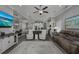 Bright and airy living room showcasing an open layout, hardwood floors, and neutral decor at 1004 Marsh View Dr., North Myrtle Beach, SC 29582