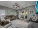 Comfortable living room featuring a ceiling fan, a sliding glass door, and recessed lighting at 1004 Marsh View Dr., North Myrtle Beach, SC 29582