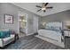 Spacious main bedroom featuring a ceiling fan, neutral walls, and ensuite bathroom at 1004 Marsh View Dr., North Myrtle Beach, SC 29582