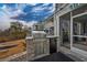 Covered outdoor kitchen with stainless steel grill and granite countertop overlooking landscaped backyard at 1004 Marsh View Dr., North Myrtle Beach, SC 29582