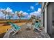 Beautiful brick patio with Adirondack chairs and barbecue, ideal for outdoor entertaining and relaxing at 1004 Marsh View Dr., North Myrtle Beach, SC 29582