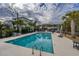 Community pool with palm trees and lounge chairs for relaxation at 1004 Marsh View Dr., North Myrtle Beach, SC 29582