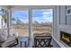 Inviting outdoor porch with a cozy fireplace and scenic views of the surrounding landscape at 1004 Marsh View Dr., North Myrtle Beach, SC 29582