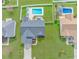 Aerial view of a backyard with a pool, outdoor seating, and a well-manicured lawn at 110 Echaw Dr., Conway, SC 29526