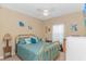 A well-lit bedroom with gold accents and a blue comforter set on the bed at 110 Echaw Dr., Conway, SC 29526