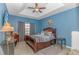 Serene bedroom featuring tray ceiling, soft lighting, and comfortable furnishings for ultimate relaxation and rest at 110 Echaw Dr., Conway, SC 29526