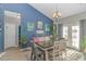 Cozy dining area with stylish chandelier, natural light, and elegant decor perfect for Gathering meals and gatherings at 110 Echaw Dr., Conway, SC 29526