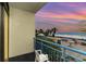 Relaxing view from the balcony, looking out over the ocean and outdoor seating area at sunset at 1105 S Ocean Blvd. # 220, Myrtle Beach, SC 29577