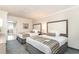 Carpeted bedroom featuring two beds and a dresser with a lamp and a beach themed artpiece at 1105 S Ocean Blvd. # 220, Myrtle Beach, SC 29577