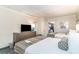 Bright bedroom with two beds, TV, and small kitchenette for a comfortable stay at 1105 S Ocean Blvd. # 220, Myrtle Beach, SC 29577