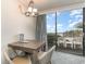Dining table with seating near a bright and sunny ocean-view balcony at 1105 S Ocean Blvd. # 220, Myrtle Beach, SC 29577