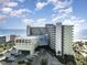 A large condo complex at the ocean with a beach front view and a parking area near the building at 1105 S Ocean Blvd. # 220, Myrtle Beach, SC 29577