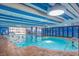 Indoor pool with bright blue accents and a tile border at 1105 S Ocean Blvd. # 220, Myrtle Beach, SC 29577