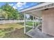 Large backyard patio featuring well-manicured lawn and covered patio at 111 S Poplar Dr., Surfside Beach, SC 29575