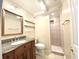 Bathroom with vanity, large mirror and tiled walk-in shower at 111 S Poplar Dr., Surfside Beach, SC 29575