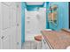 Bathroom features a shower, toilet, vanity, and blue walls at 111 S Poplar Dr., Surfside Beach, SC 29575