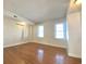 Bright bedroom with hardwood floors and dual windows at 111 S Poplar Dr., Surfside Beach, SC 29575