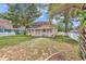 Exterior view of home with manicured lawn and a white picket fence at 111 S Poplar Dr., Surfside Beach, SC 29575