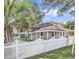Charming home featuring a white picket fence and mature trees at 111 S Poplar Dr., Surfside Beach, SC 29575