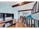 Hallway with hardwood floors, exposed beams and built-in desk at 111 S Poplar Dr., Surfside Beach, SC 29575