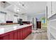 Kitchen with stainless steel appliances, custom island, and archway view to another room at 111 S Poplar Dr., Surfside Beach, SC 29575