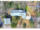 Aerial view of home with metal roof, detached garage, and driveway at 112 S Rosemary Ave., Andrews, SC 29510