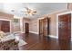 Bedroom featuring hardwood floors and a floral sofa at 112 S Rosemary Ave., Andrews, SC 29510