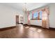 Bright room with gleaming hardwood floors and a decorative chandelier at 112 S Rosemary Ave., Andrews, SC 29510