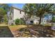 Two-story home features a lush front yard with mature shade trees at 112 S Rosemary Ave., Andrews, SC 29510