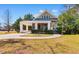 Charming two-story home with a covered carport and inviting front porch at 112 S Rosemary Ave., Andrews, SC 29510