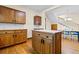 Cozy kitchen featuring hardwood floors, center island and connection to stairway at 112 S Rosemary Ave., Andrews, SC 29510
