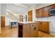 Open kitchen featuring hardwood floors, center island and connection to dining area at 112 S Rosemary Ave., Andrews, SC 29510