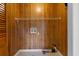 Utility room featuring wood-paneled wall, shelf and utility connections at 112 S Rosemary Ave., Andrews, SC 29510