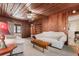 Comfortable living room with light colored furniture and wood paneled walls and ceiling at 112 S Rosemary Ave., Andrews, SC 29510