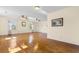 Spacious living room featuring hardwood floors, ceiling fans and abundant natural light at 112 S Rosemary Ave., Andrews, SC 29510