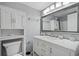 Well-appointed bathroom featuring vanity with marble countertop, modern mirror, and storage at 1207 Ocean Blvd. S # 50801, Myrtle Beach, SC 29577