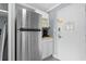 Compact kitchen area with modern stainless steel refrigerator, coffee maker, and microwave at 1207 Ocean Blvd. S # 50801, Myrtle Beach, SC 29577