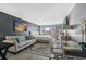 Comfortable living room featuring a modern sofa, work space, and stylish decor at 1207 Ocean Blvd. S # 50801, Myrtle Beach, SC 29577