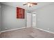 Neutral bedroom featuring a ceiling fan, carpeted floors, and an open doorway at 125 Dayglow Dr., Loris, SC 29569