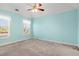 Aqua bedroom boasting bright natural light, carpeted floors and a ceiling fan at 125 Dayglow Dr., Loris, SC 29569