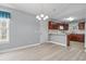 Cozy dining area with views into the kitchen, laminate floors and modern lighting at 125 Dayglow Dr., Loris, SC 29569